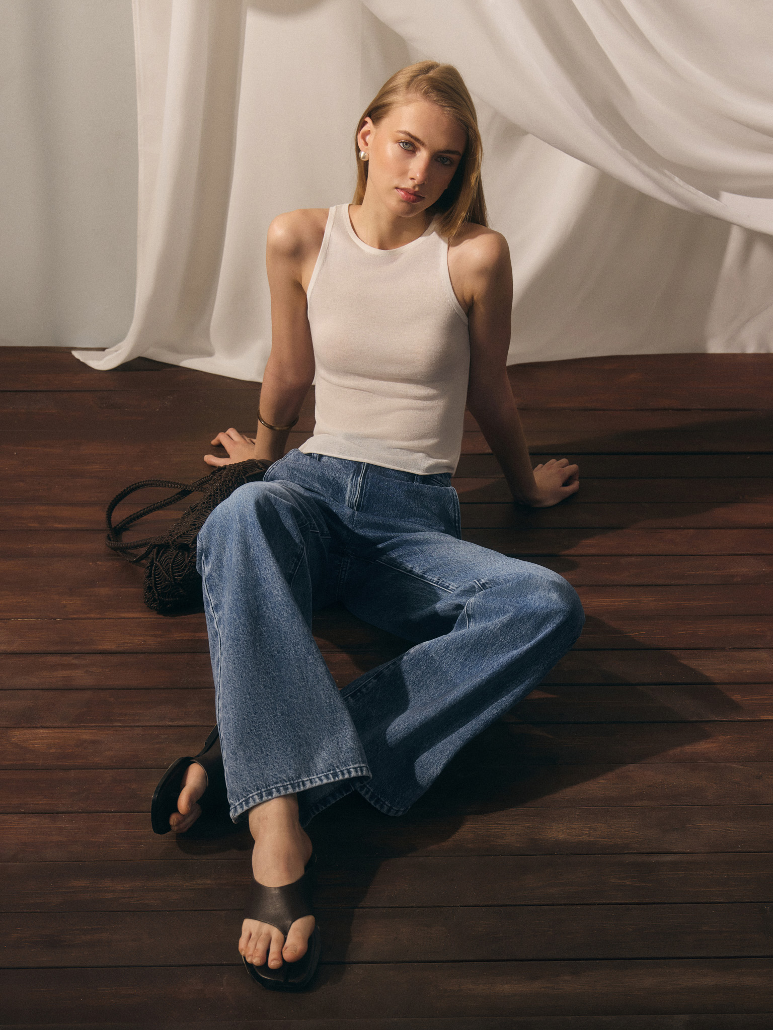 Flared denim jeans with distressed details