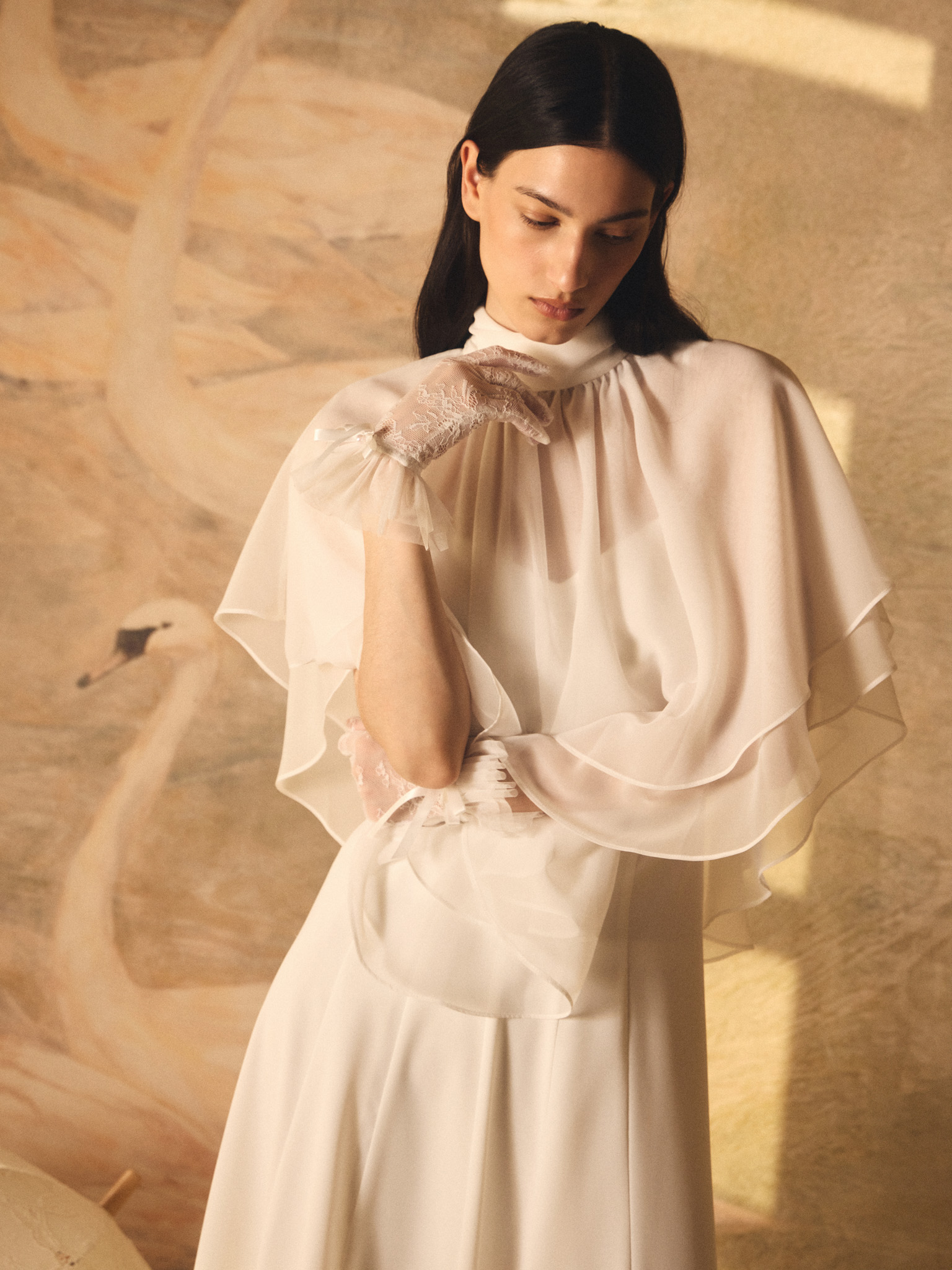 Maxi dress with a layered semi-transparent cape