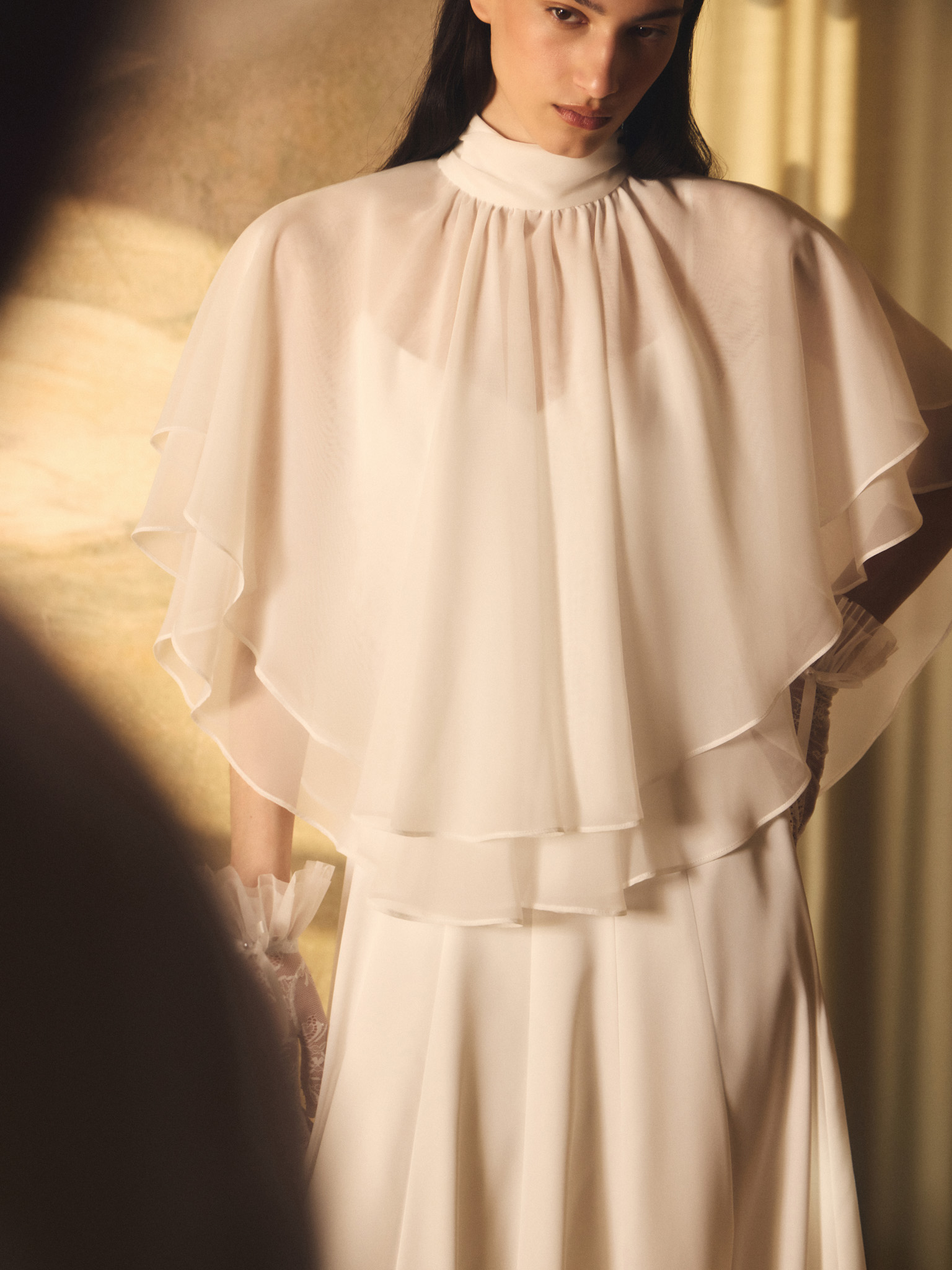 Maxi dress with a layered semi-transparent cape