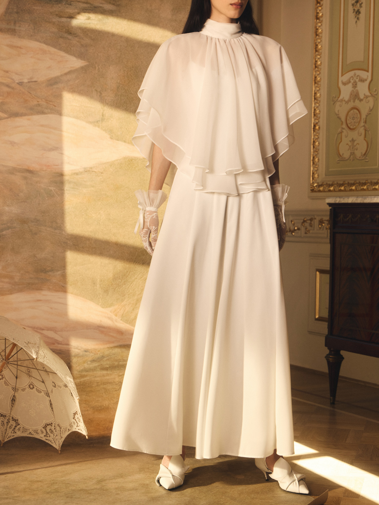 Maxi dress with a layered semi-transparent cape