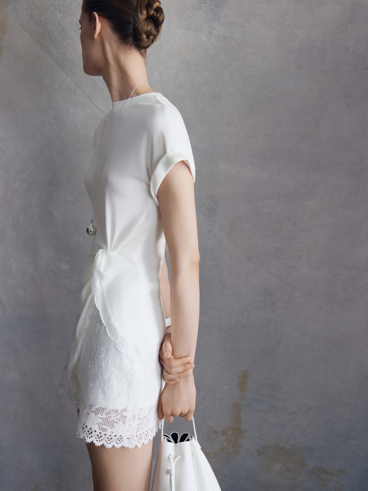 Long-line T-shirt with draping and lace trim along the hem