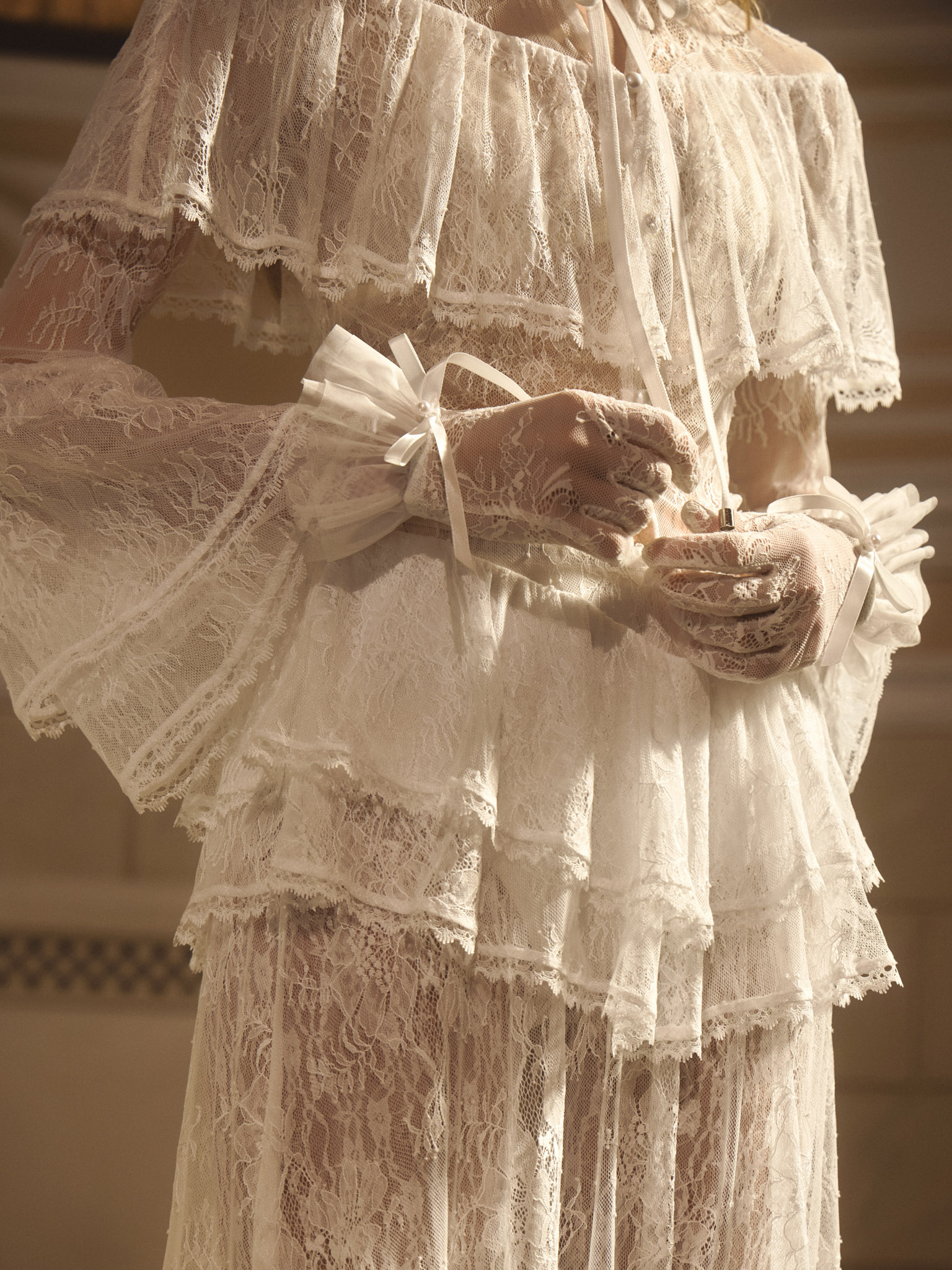 Lace gloves with draping at the cuffs