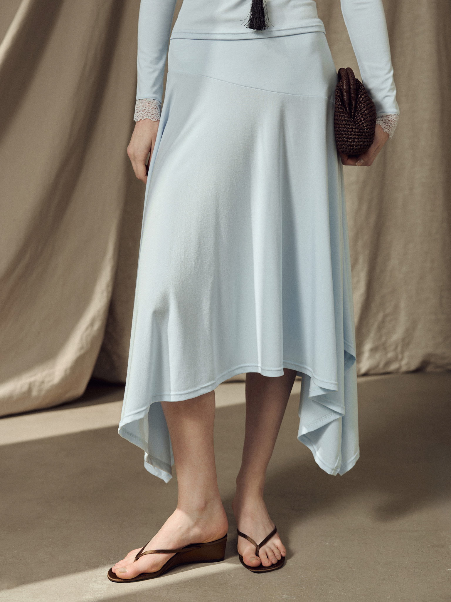 Jersey midi skirt with an asymmetrical hem