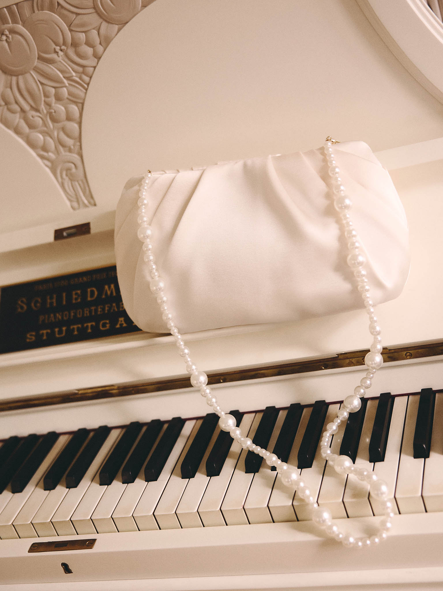 Satin clutch with pearl thread