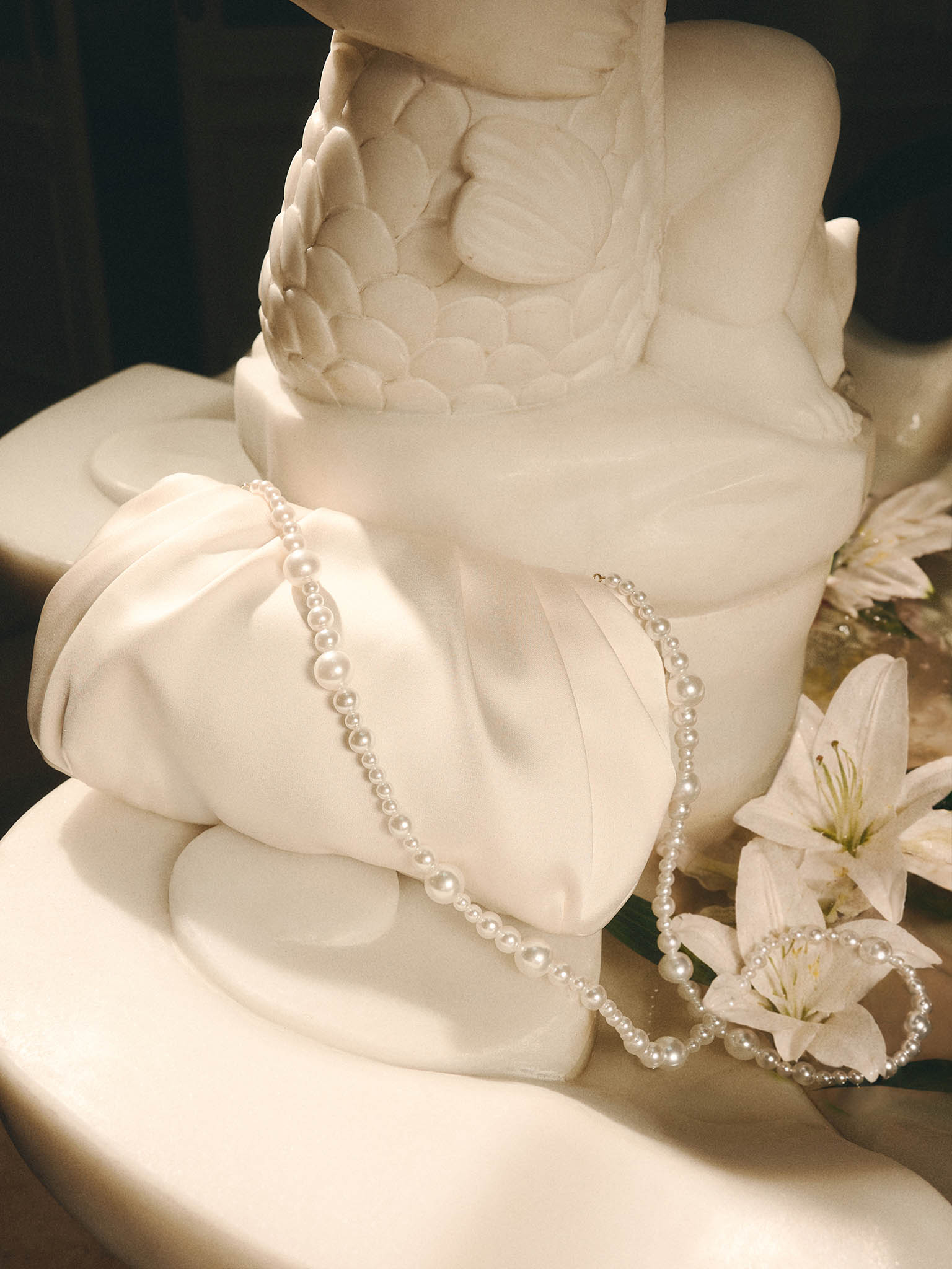 Satin clutch with pearl thread