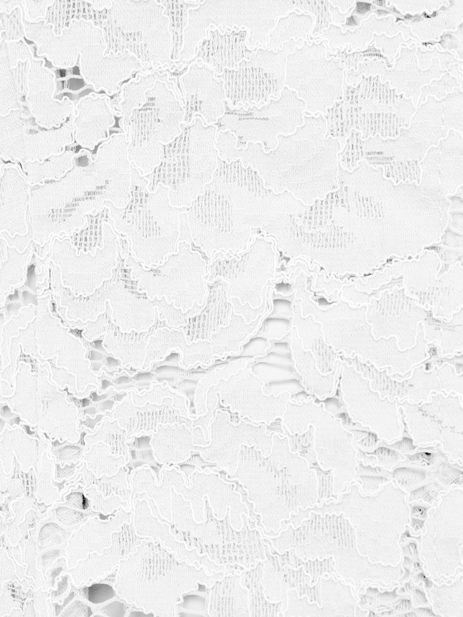 Blouse ajustée en guipure, avec encolure en goutte d'eau et basque
