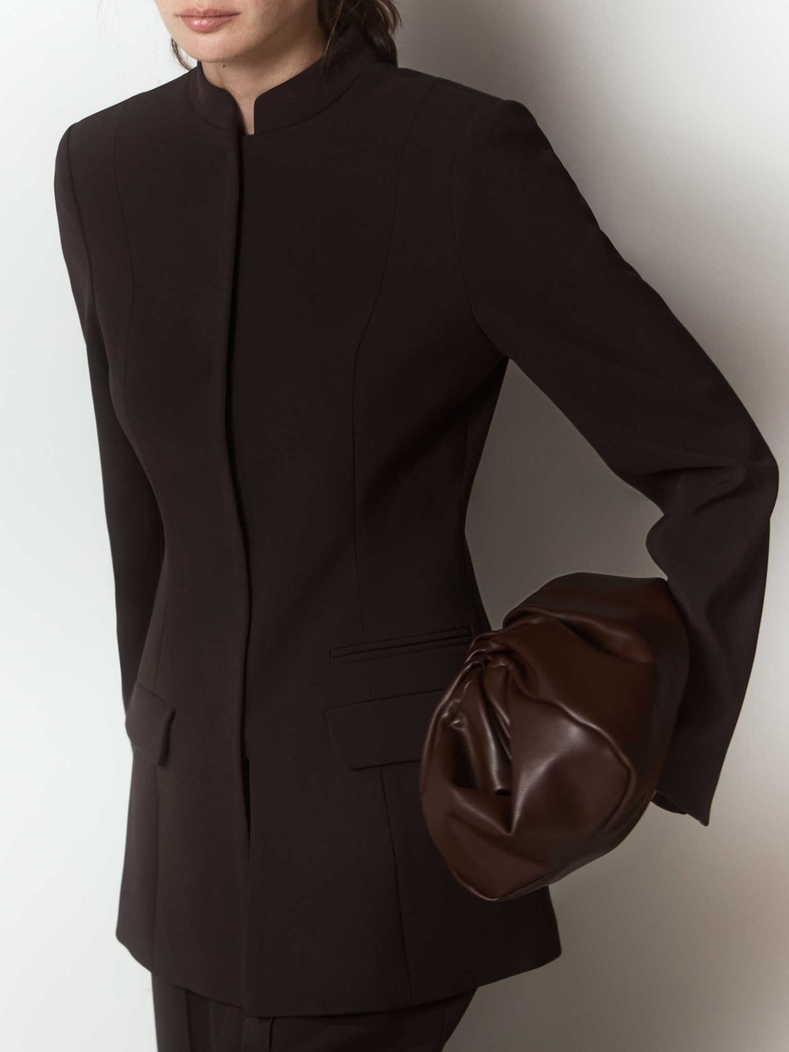 Fitted single-breasted jacket with a hidden fastening