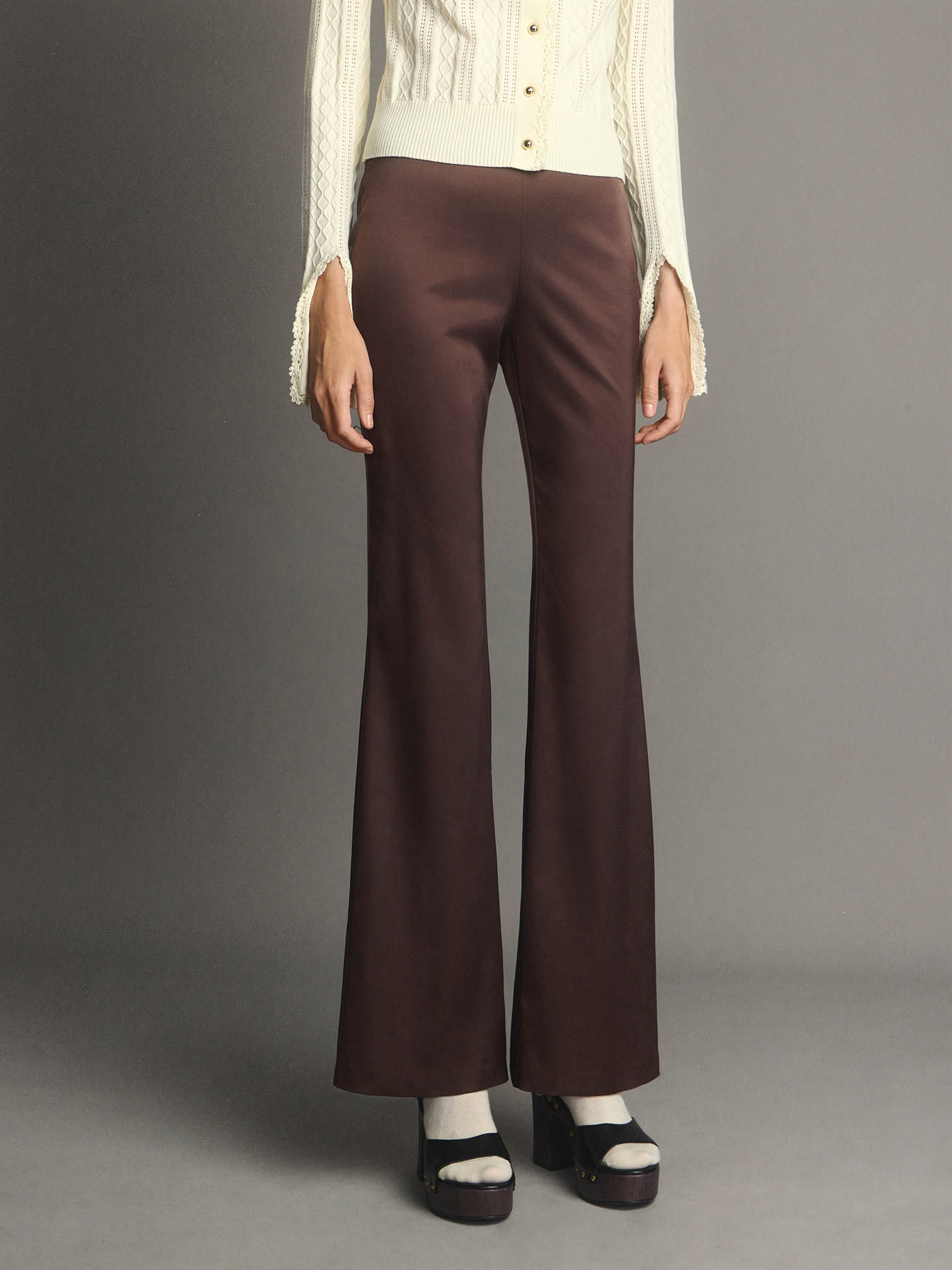Flared trousers made from heavy fabric, flaring from the knee